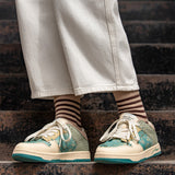 Stílusos unisex művész sneakers mandulavirág mintával – Arta